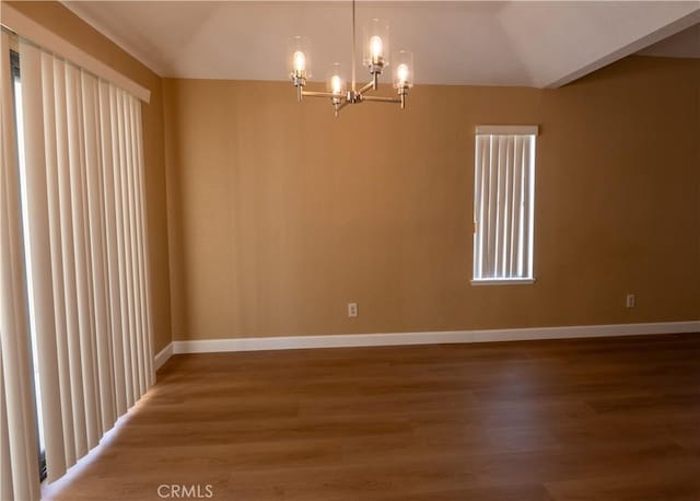 22760 Mountain View Rd, Moreno Valley, CA 92557 - empty room with a chandelier, wood finished floors, and lofted ceiling