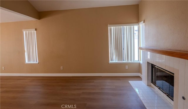 22760 Mountain View Rd, Moreno Valley, CA 92557 - unfurnished living room with a fireplace, wood finished floors, and lofted ceiling