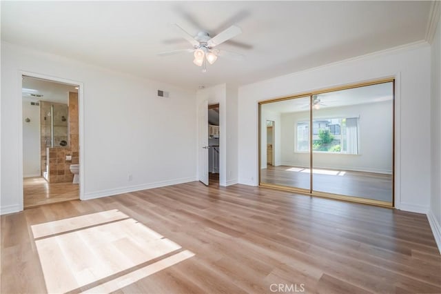 2239 Maystone Pl, Rowland Heights, CA 91748 - unfurnished bedroom featuring light wood-style flooring, a closet, crown molding, a ceiling fan, and connected bathroom