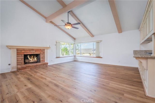 2239 Maystone Pl, Rowland Heights, CA 91748 - unfurnished living room featuring beamed ceiling, light wood-type flooring, a ceiling fan, a brick fireplace, and high vaulted ceiling