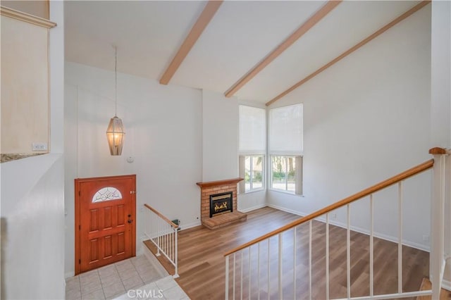 2239 Maystone Pl, Rowland Heights, CA 91748 - foyer with beam ceiling, high vaulted ceiling, a fireplace, wood finished floors, and stairway