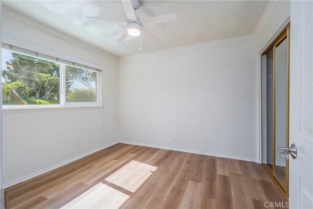 2239 Maystone Pl, Rowland Heights, CA 91748 - unfurnished bedroom with light wood finished floors, ornamental molding, a closet, and a ceiling fan