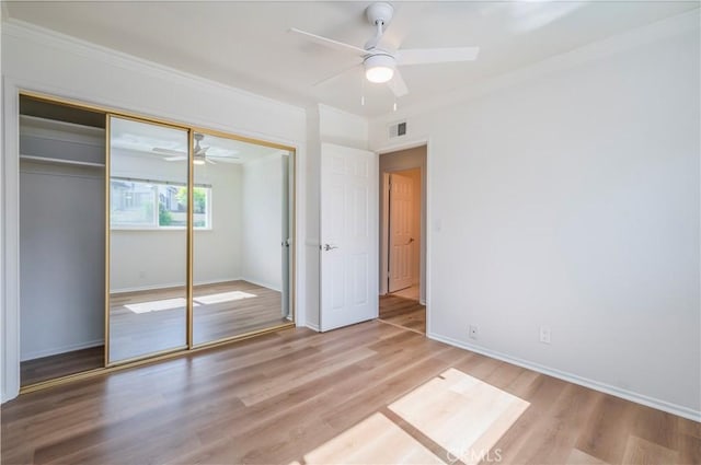 2239 Maystone Pl, Rowland Heights, CA 91748 - unfurnished bedroom with crown molding, light wood-type flooring, a closet, and a ceiling fan