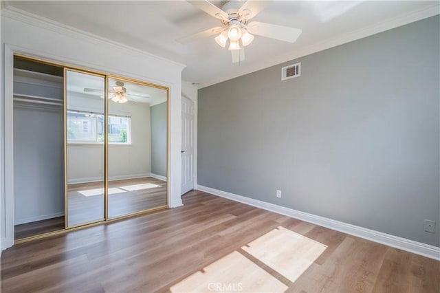2239 Maystone Pl, Rowland Heights, CA 91748 - unfurnished bedroom featuring ornamental molding, wood finished floors, a closet, and a ceiling fan