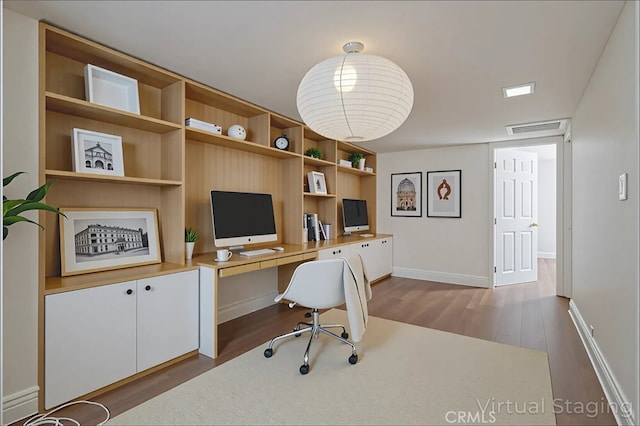 2239 Maystone Pl, Rowland Heights, CA 91748 - home office featuring wood finished floors, built in desk, and built in shelves