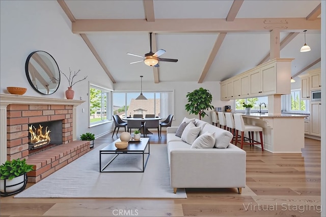 2239 Maystone Pl, Rowland Heights, CA 91748 - living area with beamed ceiling, light wood-type flooring, a ceiling fan, high vaulted ceiling, and a fireplace