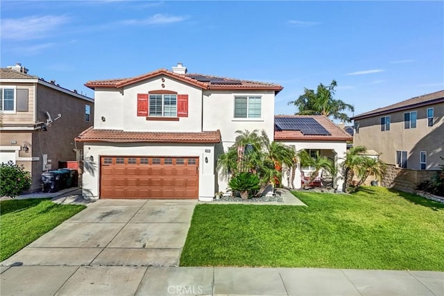6512 Cedar Creek Rd, Eastvale, CA 92880 - mediterranean / spanish-style house featuring roof mounted solar panels, driveway, a front lawn, a garage, and stucco siding