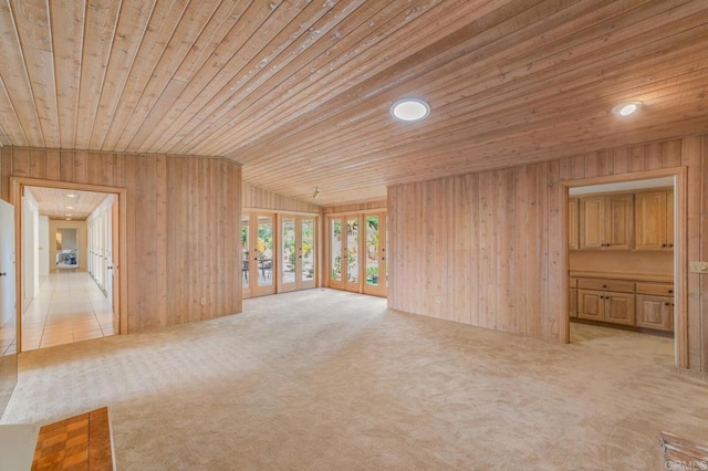 4678 Sun Vly, Del Mar, CA 92014 - unfurnished living room with wooden ceiling, light colored carpet, wooden walls, vaulted ceiling, and recessed lighting