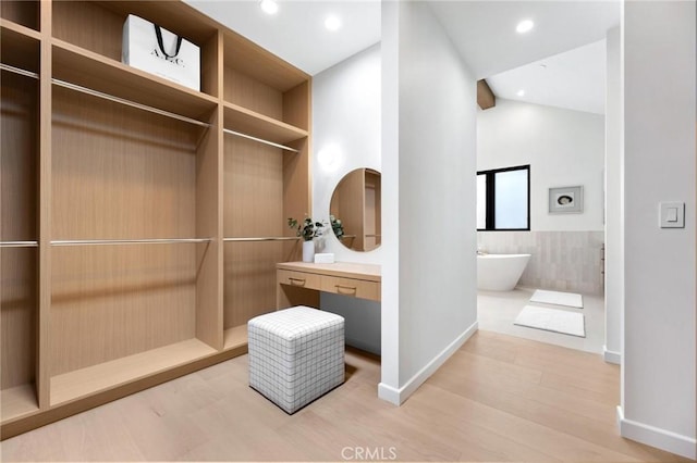 2206 Gates Ave Unit A, Redondo Beach, CA 90278 - full bath with a freestanding tub, lofted ceiling, vanity, wood finished floors, and recessed lighting
