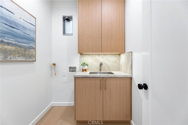 2206 Gates Ave Unit A, Redondo Beach, CA 90278 - laundry area with cabinet space, hookup for a washing machine, and light wood-style flooring