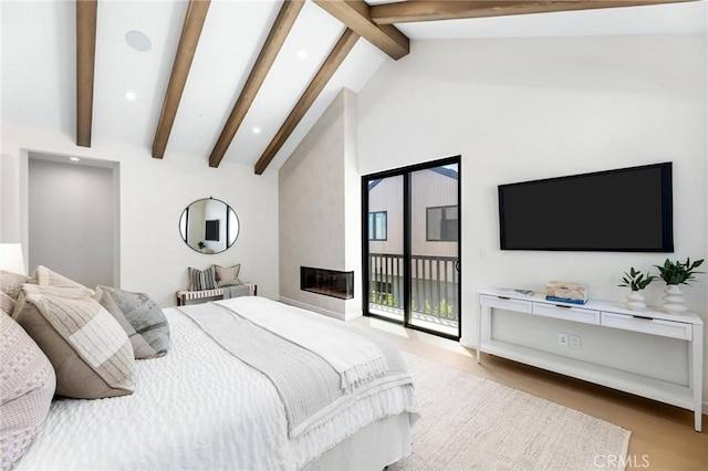 2206 Gates Ave Unit A, Redondo Beach, CA 90278 - bedroom with access to outside, recessed lighting, a large fireplace, and light wood-style floors