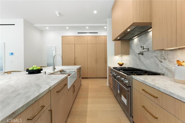 2206 Gates Ave Unit A, Redondo Beach, CA 90278 - kitchen featuring high end stainless steel range oven, light brown cabinets, tasteful backsplash, light stone countertops, and recessed lighting