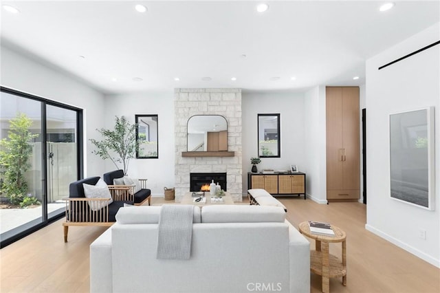 2206 Gates Ave Unit A, Redondo Beach, CA 90278 - living room featuring light wood-style floors, recessed lighting, and a stone fireplace
