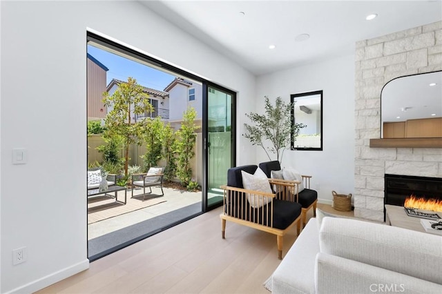 2206 Gates Ave Unit A, Redondo Beach, CA 90278 - living area with wood finished floors, a stone fireplace, and recessed lighting