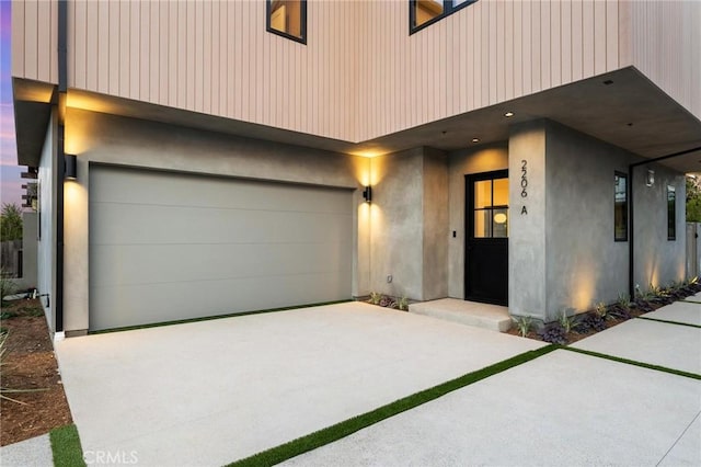 2206 Gates Ave Unit A, Redondo Beach, CA 90278 - view of front of property featuring an attached garage, concrete driveway, and stucco siding