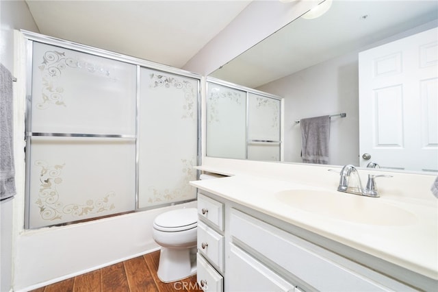 11718 Lucena Ave, Fontana, CA 92337 - bathroom with wood finished floors, vanity, and enclosed tub / shower combo