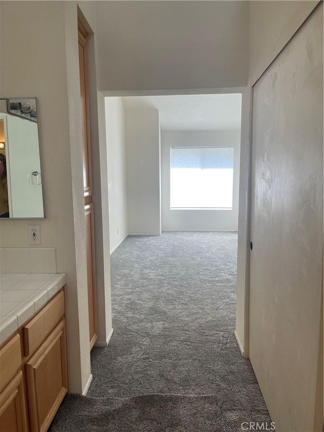 20301 Bluffside Cir Unit D406, Huntington Beach, CA 92646 - hallway with dark carpet