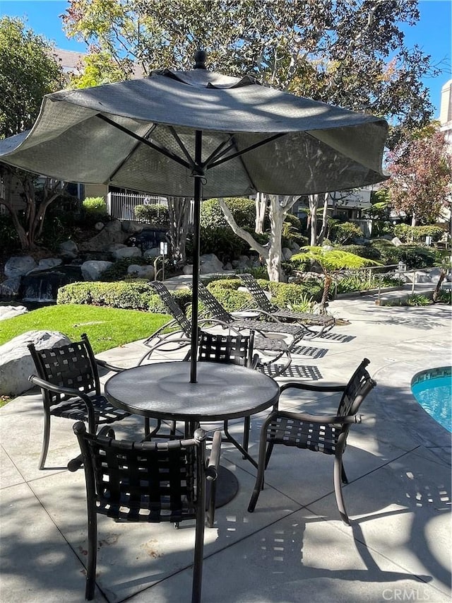 20301 Bluffside Cir Unit D406, Huntington Beach, CA 92646 - view of patio featuring outdoor dining area