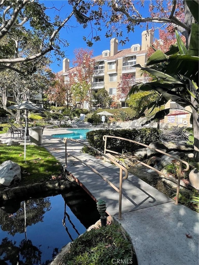 20301 Bluffside Cir Unit D406, Huntington Beach, CA 92646 - view of community featuring a swimming pool
