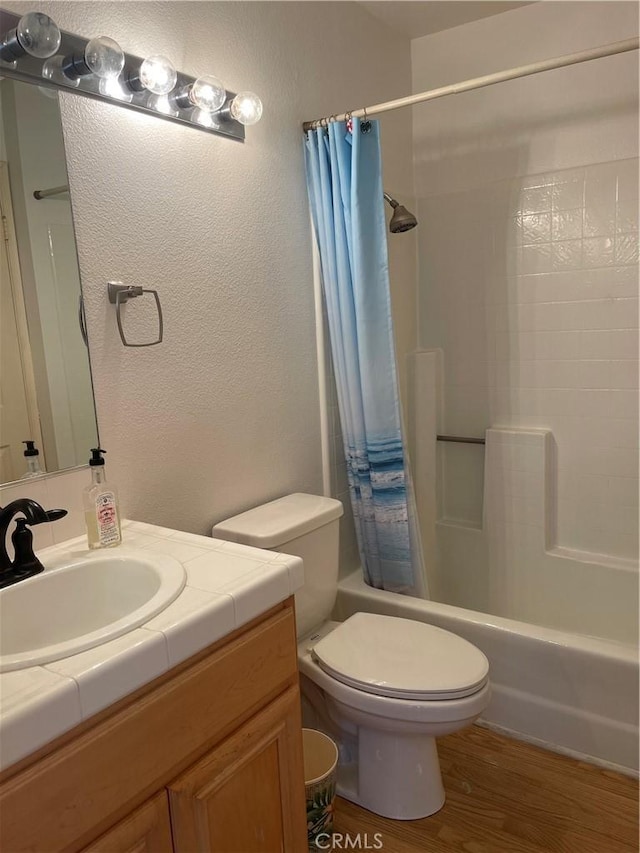 20301 Bluffside Cir Unit D406, Huntington Beach, CA 92646 - full bath with vanity, shower / bath combo, wood finished floors, and a textured wall