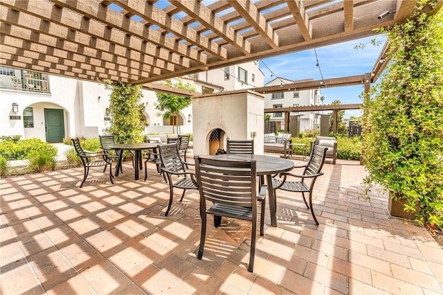 1446 Azalea Cir, Gardena, CA 90247 - view of patio with exterior fireplace, outdoor dining space, and a pergola