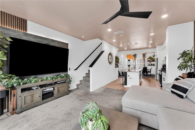 1446 Azalea Cir, Gardena, CA 90247 - living room with recessed lighting, a ceiling fan, stairs, and light wood-style flooring