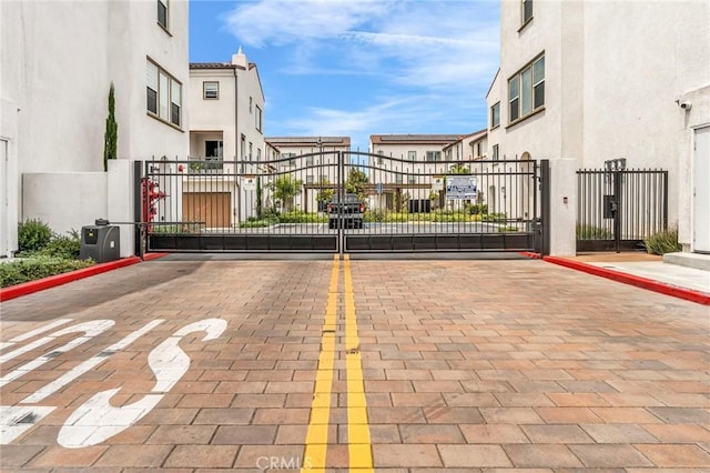 1446 Azalea Cir, Gardena, CA 90247 - view of decorative street with a gate, curbs, and a gated entry