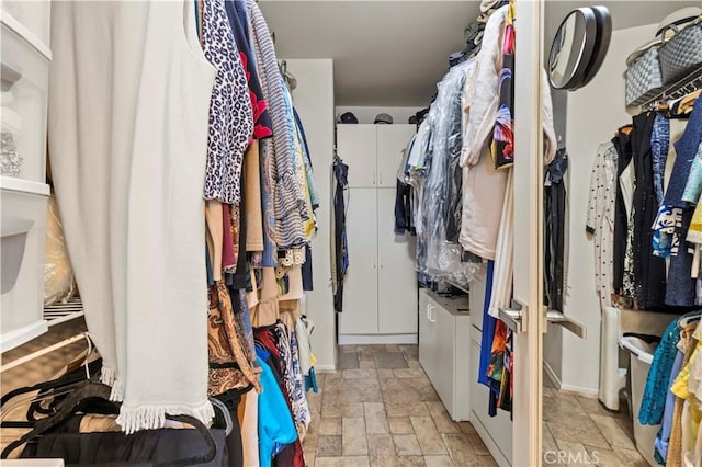 29508 Alyssum Ln, Canyon Country, CA 91387 - walk in closet featuring stone tile flooring