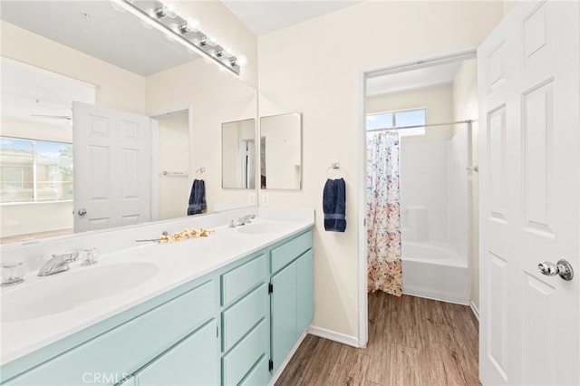 39719 Princeton Way Unit C, Murrieta, CA 92563 - bathroom with wood finished floors, double vanity, and shower / bath combo with shower curtain