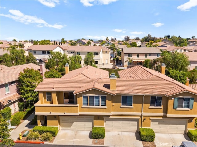 39719 Princeton Way Unit C, Murrieta, CA 92563 - view of front of house featuring a residential view, a tile roof, stucco siding, and driveway