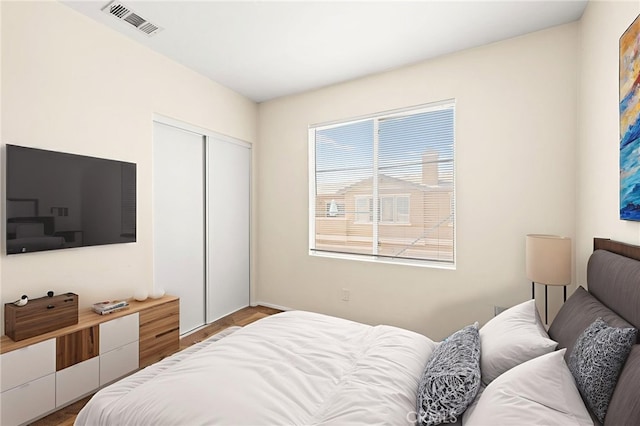 39719 Princeton Way Unit C, Murrieta, CA 92563 - bedroom with a closet and wood finished floors
