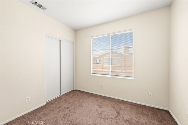 39719 Princeton Way Unit C, Murrieta, CA 92563 - unfurnished bedroom featuring carpet flooring and a closet