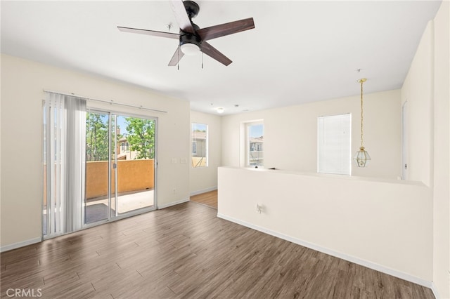 39719 Princeton Way Unit C, Murrieta, CA 92563 - unfurnished room with wood finished floors and a ceiling fan
