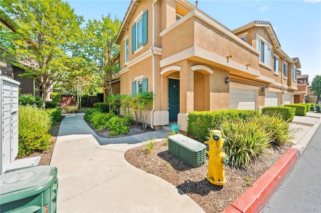 39719 Princeton Way Unit C, Murrieta, CA 92563 - view of building exterior with an attached garage