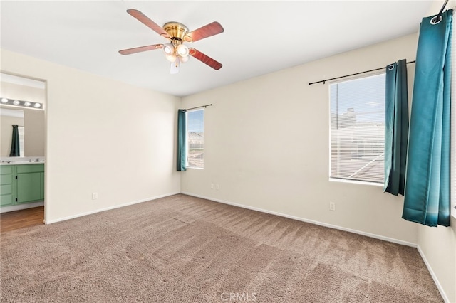 39719 Princeton Way Unit C, Murrieta, CA 92563 - unfurnished bedroom featuring carpet, connected bathroom, and a ceiling fan