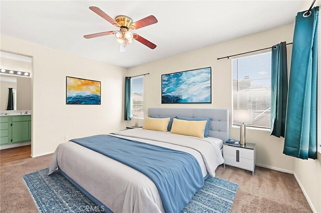 39719 Princeton Way Unit C, Murrieta, CA 92563 - bedroom with light carpet, ensuite bathroom, and a ceiling fan