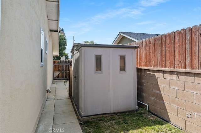 1329 S St Malo St, West Covina, CA 91790 - view of side of home featuring a storage shed