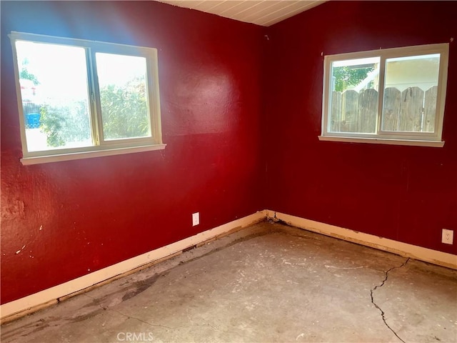 2441 Madrone St, Sutter, CA 95982 - empty room featuring concrete floors and vaulted ceiling