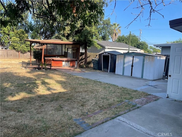 2441 Madrone St, Sutter, CA 95982 - rear view of property with a hot tub, a storage shed, and a patio