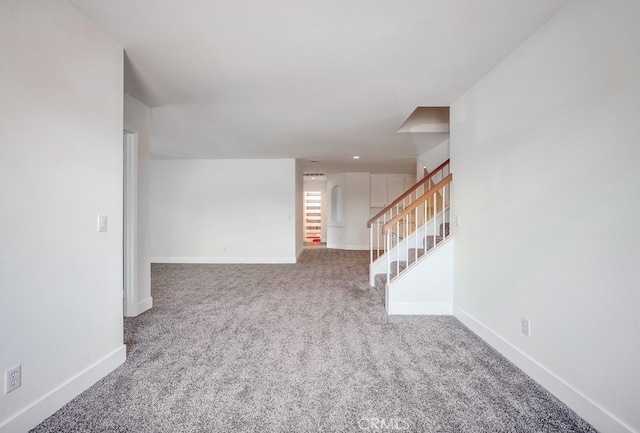 8550 Rolling Hills Dr, Corona, CA 92883 - unfurnished living room with stairs and carpet flooring