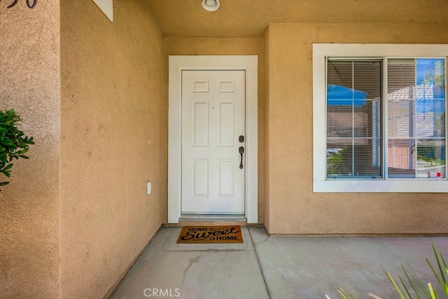 8550 Rolling Hills Dr, Corona, CA 92883 - property entrance with stucco siding