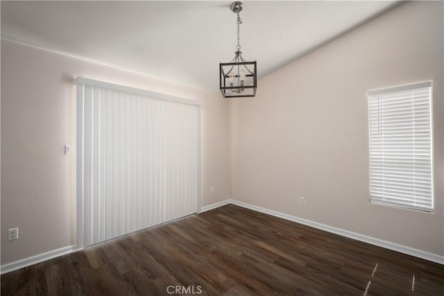 5224 Sierra Caves Ave, Bakersfield, CA 93313 - unfurnished dining area with dark wood-type flooring and a chandelier