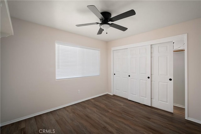 5224 Sierra Caves Ave, Bakersfield, CA 93313 - unfurnished bedroom featuring dark wood-style flooring, a closet, and a ceiling fan