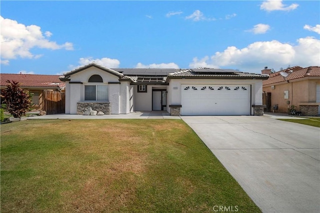 5224 Sierra Caves Ave, Bakersfield, CA 93313 - ranch-style house with stone siding, stucco siding, roof mounted solar panels, driveway, and an attached garage