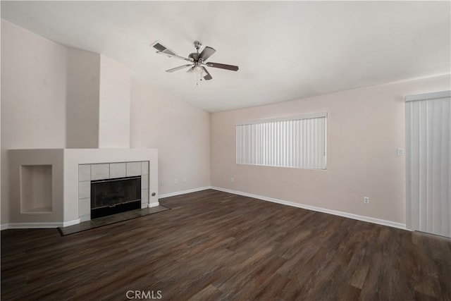 5224 Sierra Caves Ave, Bakersfield, CA 93313 - unfurnished living room with lofted ceiling, dark wood finished floors, a ceiling fan, and a tile fireplace