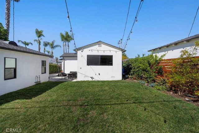 1834 Stearns Dr, Los Angeles, CA 90035 - rear view of house featuring stucco siding and a patio