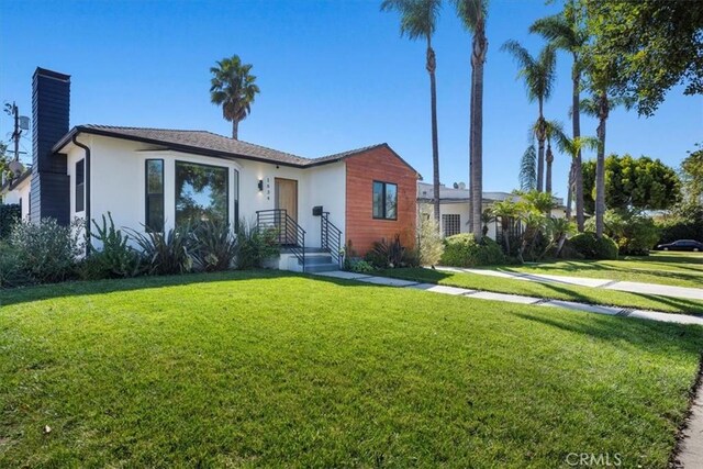 1834 Stearns Dr, Los Angeles, CA 90035 - ranch-style home with a front yard, a chimney, and stucco siding