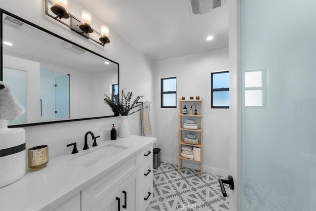 1834 Stearns Dr, Los Angeles, CA 90035 - bathroom with vanity, walk in shower, and recessed lighting