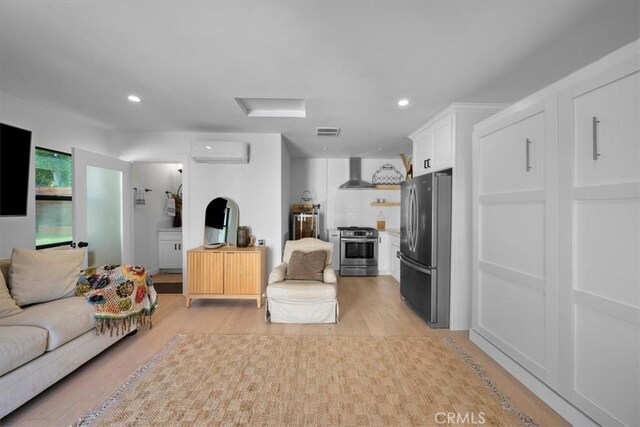 1834 Stearns Dr, Los Angeles, CA 90035 - living area featuring attic access, a wall mounted air conditioner, light wood-style floors, and recessed lighting