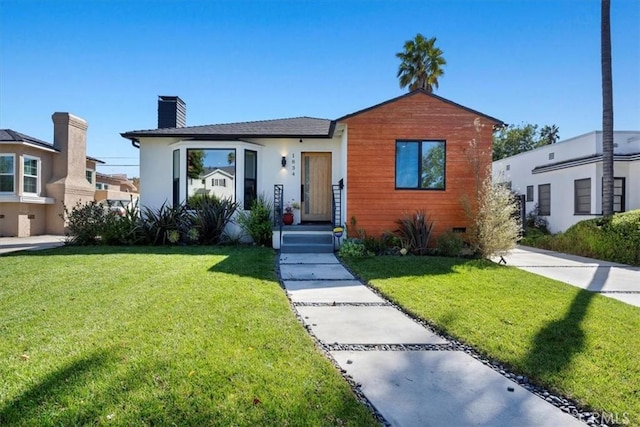 1834 Stearns Dr, Los Angeles, CA 90035 - bungalow featuring a chimney, a front lawn, and stucco siding